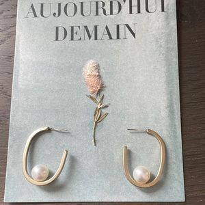 Gold color hoop with white faux pearl